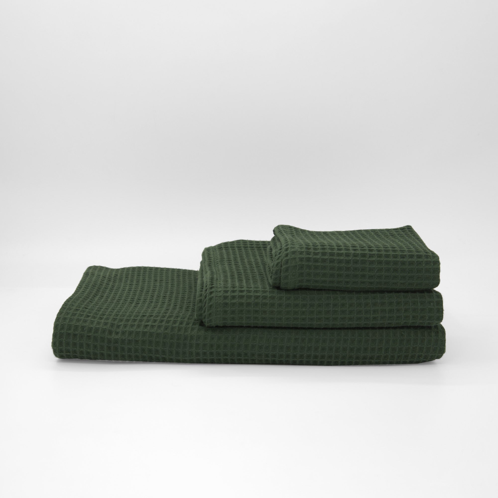 Serviette gaufrée 100% coton vert bouteille